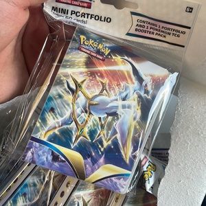 Mini portfolio holds 60 cards no booster pack included only booklet